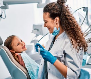 Children's,Dentistry.,A,Child,Is,Sitting,In,A,Dental,Chair